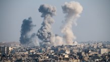 Thick columns of smoke were seen rising over the city of Aleppo