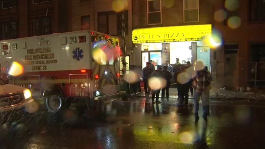 Police and an ambulance outside Pete's Pizza