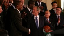 This Sept. 19, 2008, photo shows President George W. Bush and Boston Celtics captain Paul Pierce shake hands as the team visited the White House following their championship victory.