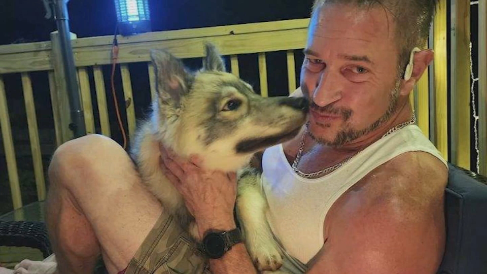 Kirk Rumford and his husky puppy Odin