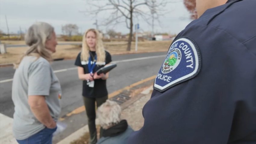 Camden County police and social worker helping couple experiencing homelessness