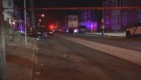 Red police tape surrounds scene of shooting where a man was killed in West Philly