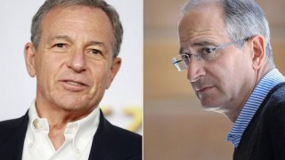 Bob Iger, CEO of Disney (L), and Brian Roberts, CEO of Comcast (R).