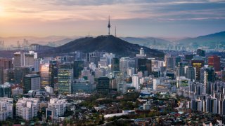 Sunrise scene of Seoul downtown city skyline, Aerial view of N Seoul Tower at Namsan Park in twilight sky in morning. The best viewpoint and trekking from inwangsan mountain in Seoul city, South Korea