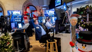 Traders work on the floor of the New York Stock Exchange on Dec. 9, 2024.