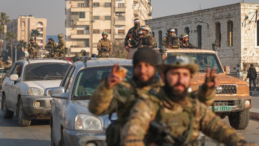 Syrian opposition fighters ride along