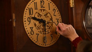 Bethany Gill winds a clock in the Pennsylvania Supreme Court chamber, Dec. 13, 2024, in Harrisburg, Pa. It's one of 273 clocks in Pennsylvania's ornate state Capitol complex buildings that must be wound by hand.