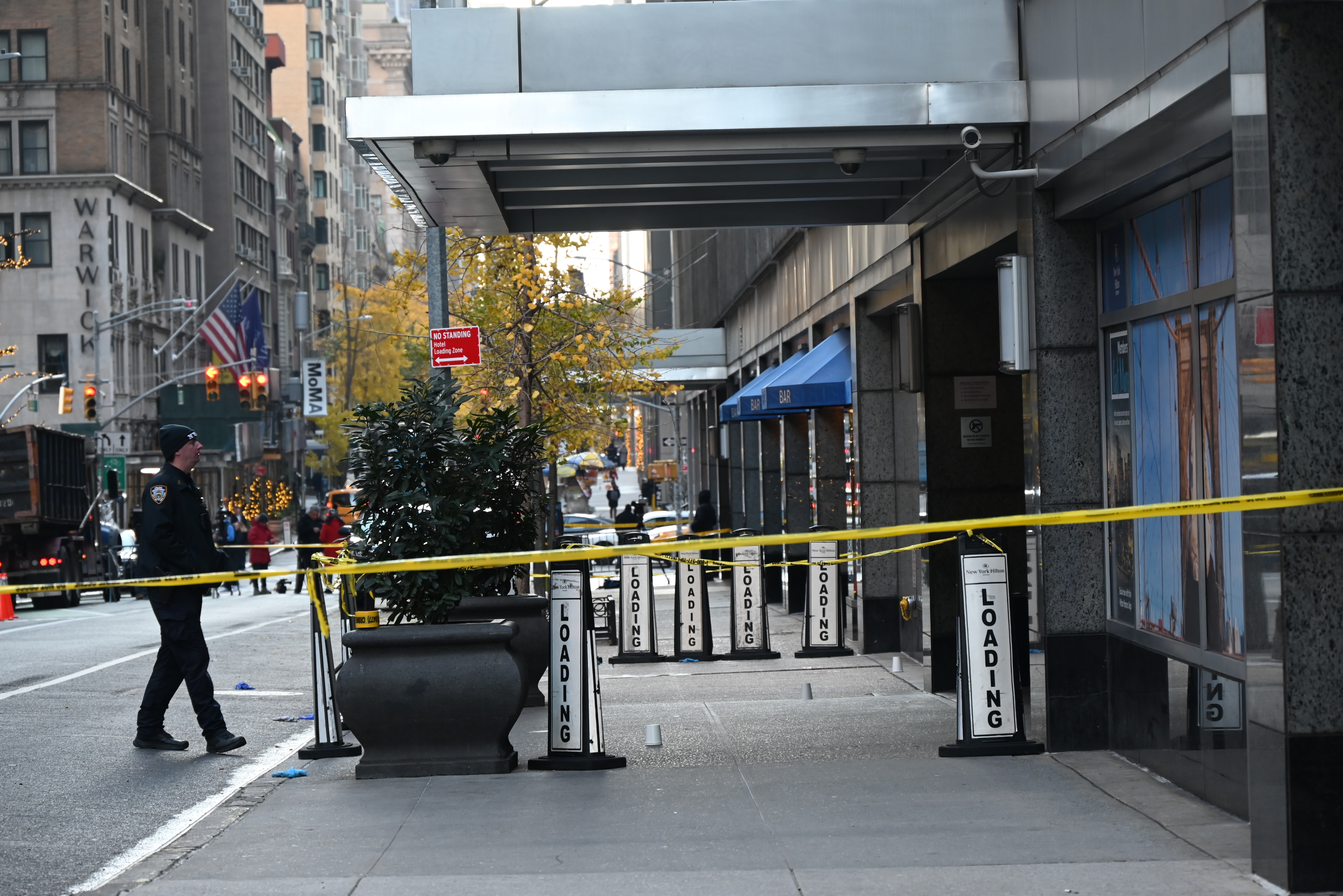 MANHATTAN, NEW YORK, UNITED STATES - DECEMBER 4: Police officers take security measures as CEO of UnitedHealthcare Brian Thompson shot and killed in Midtown Manhattan, New York, United States on December 4, 2024. The CEO of UnitedHealthcare was killed in a Midtown shooting near a hotel on 54th Street between 6th and 7th Avenues. He was rushed to an area hospital and later died. (Photo by Kyle Mazza/Anadolu via Getty Images)