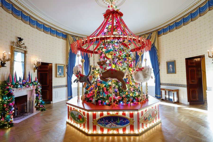 A carousel surrounds the White House Christmas Tree during a media preview of the 2024 holiday decorations at the White House  on Dec. 2, 2024, in Washington, D.C. The theme for this year's White House holiday decorations is “Season of Peace and Light.”