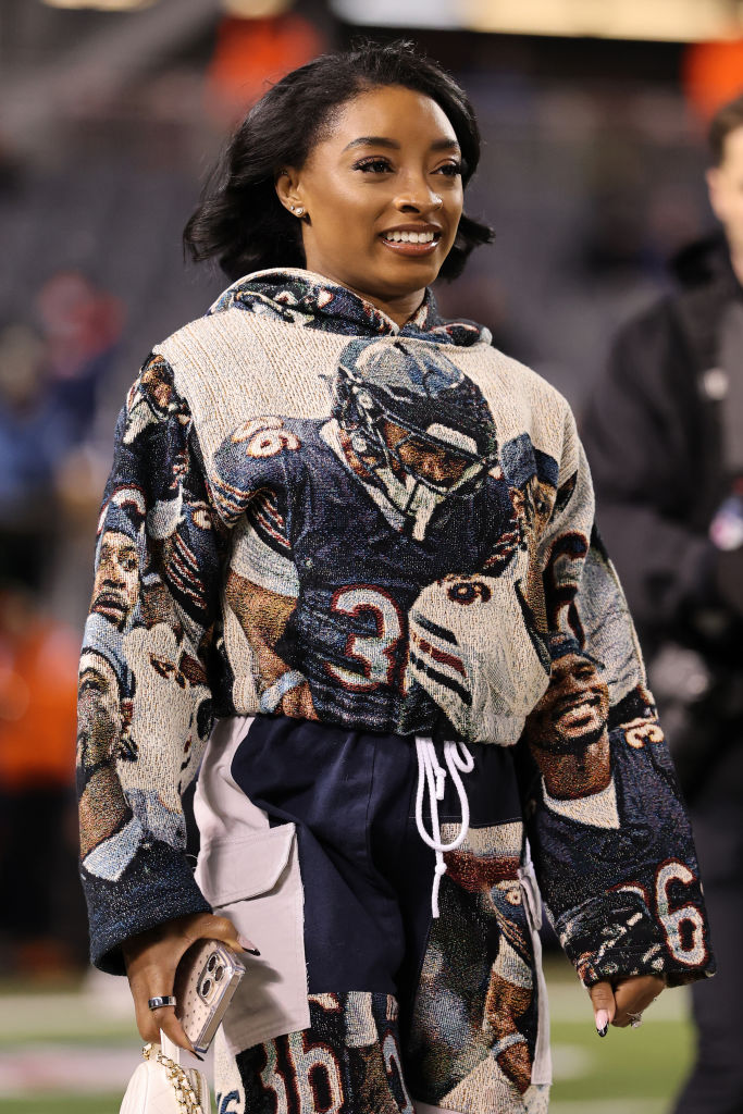 CHICAGO, ILLINOIS - DECEMBER 26: Gymnast Simone Biles looks on before the game between the Seattle Seahawks and the Chicago Bears at Soldier Field on December 26, 2024 in Chicago, Illinois. (Photo by Michael Reaves/Getty Images)