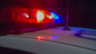 Red and blue Lights of police car in night time.