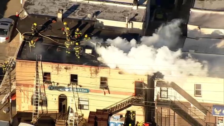 Fire crews work to put out a fire at the Carangi Baking Company in South Philadelphia on Thursday, Dec. 12, 2024.