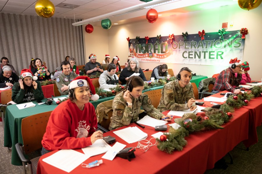 Volunteers man the desks in Colorado, where NORAD is tracking Santa's flight.