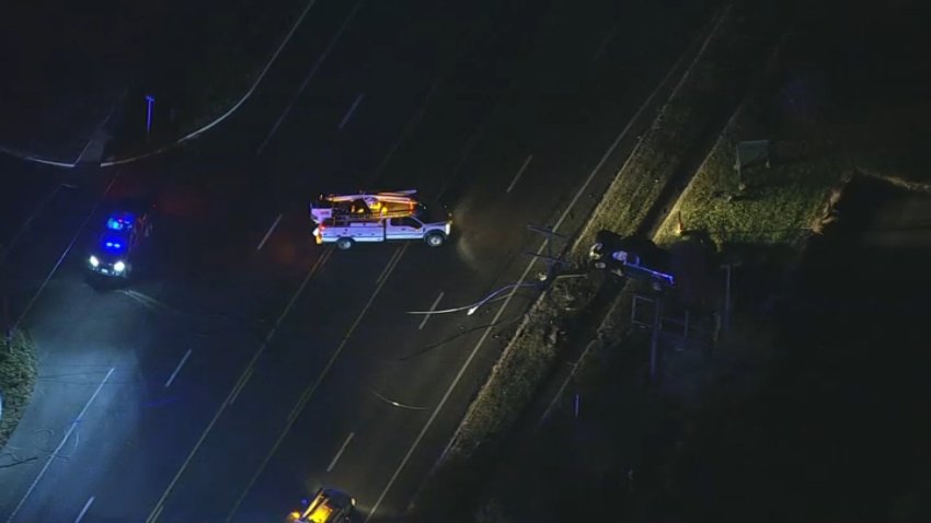 Emergency vehicles near crashed pickup truck