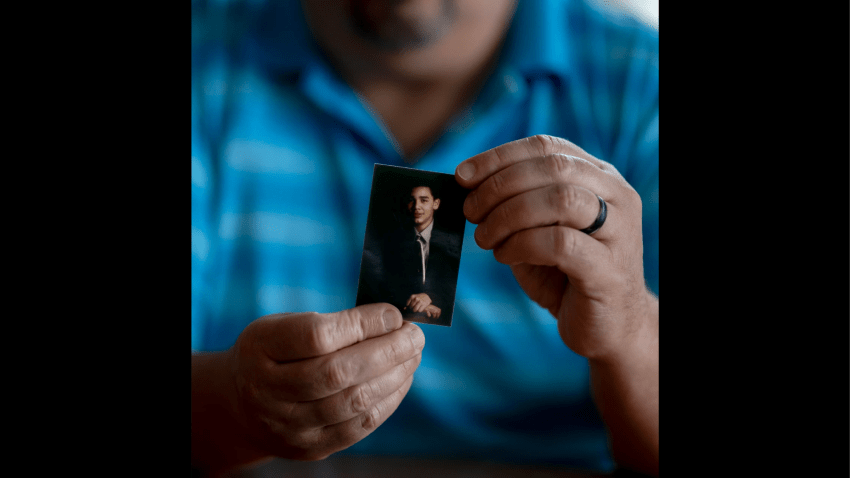 Hector Adames holds a photo of his nephew Joshua