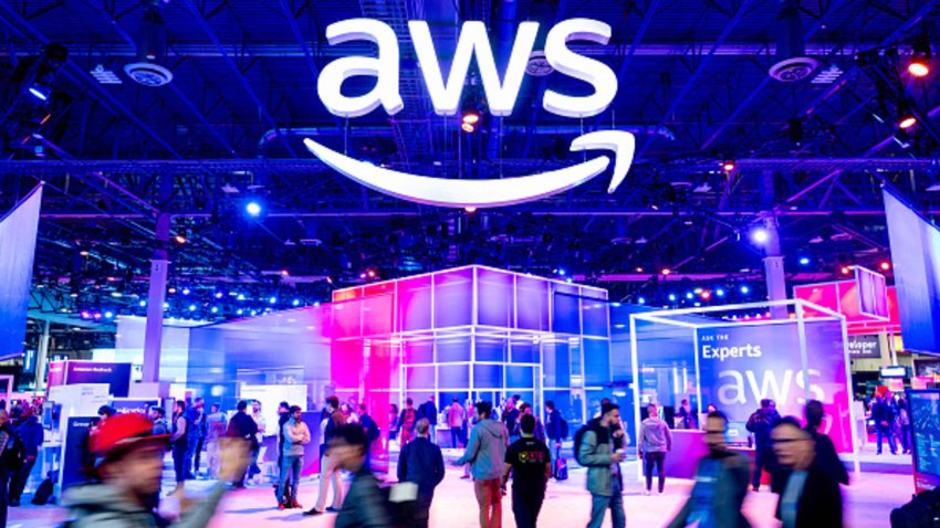 Attendees walk through an expo hall at AWS re:Invent, a conference hosted by Amazon Web Services, at the Venetian in Las Vegas on Nov. 28, 2023.