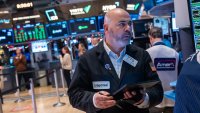 Traders work on the floor of the New York Stock Exchange on the first day of trading of the year on Jan. 2, 2025.