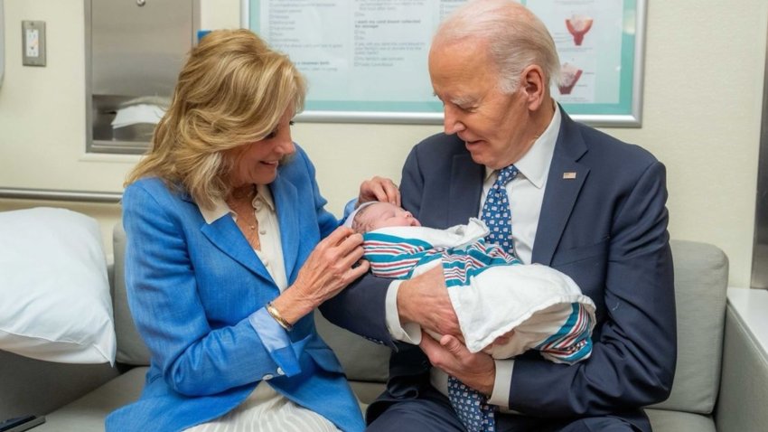 Joe and Jill Biden in a hospital holding their great-grandson.