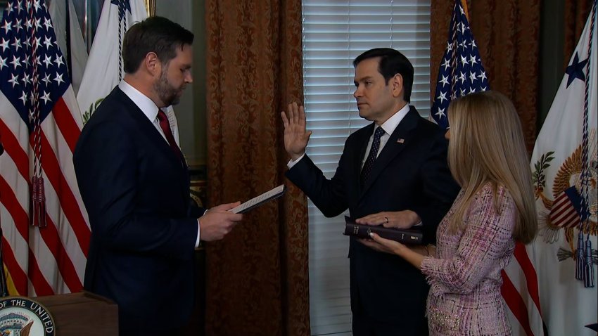 Marco Rubio with hand on bible sworn in by JD Vance