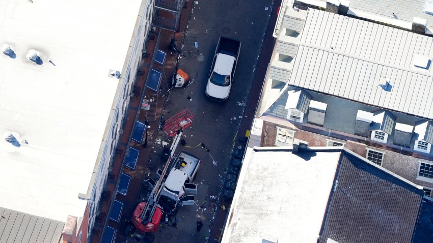 Investigators work the scene after a person drove a vehicle into a crowd earlier on Canal and Bourbon Street in New Orleans, Wednesday, Jan. 1, 2025.