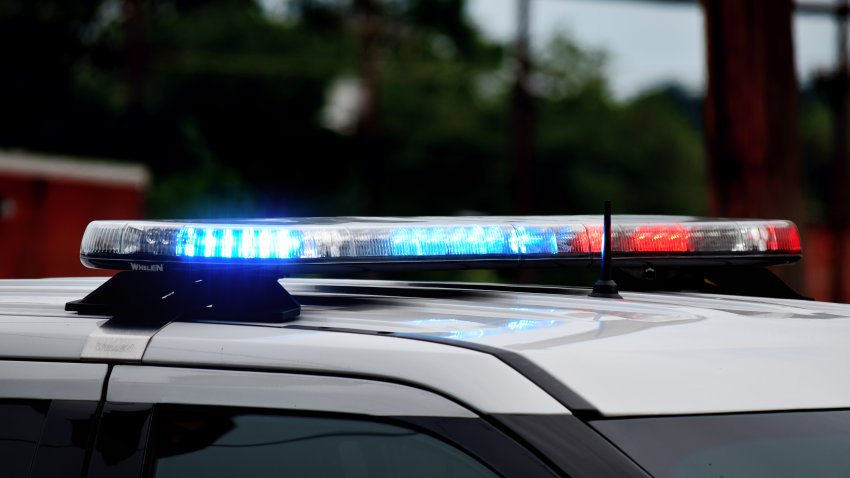 Police car flashing lights close up. Top of police car with flashing lights in daytime. Blue and red lights. Police at crime or accident scene.