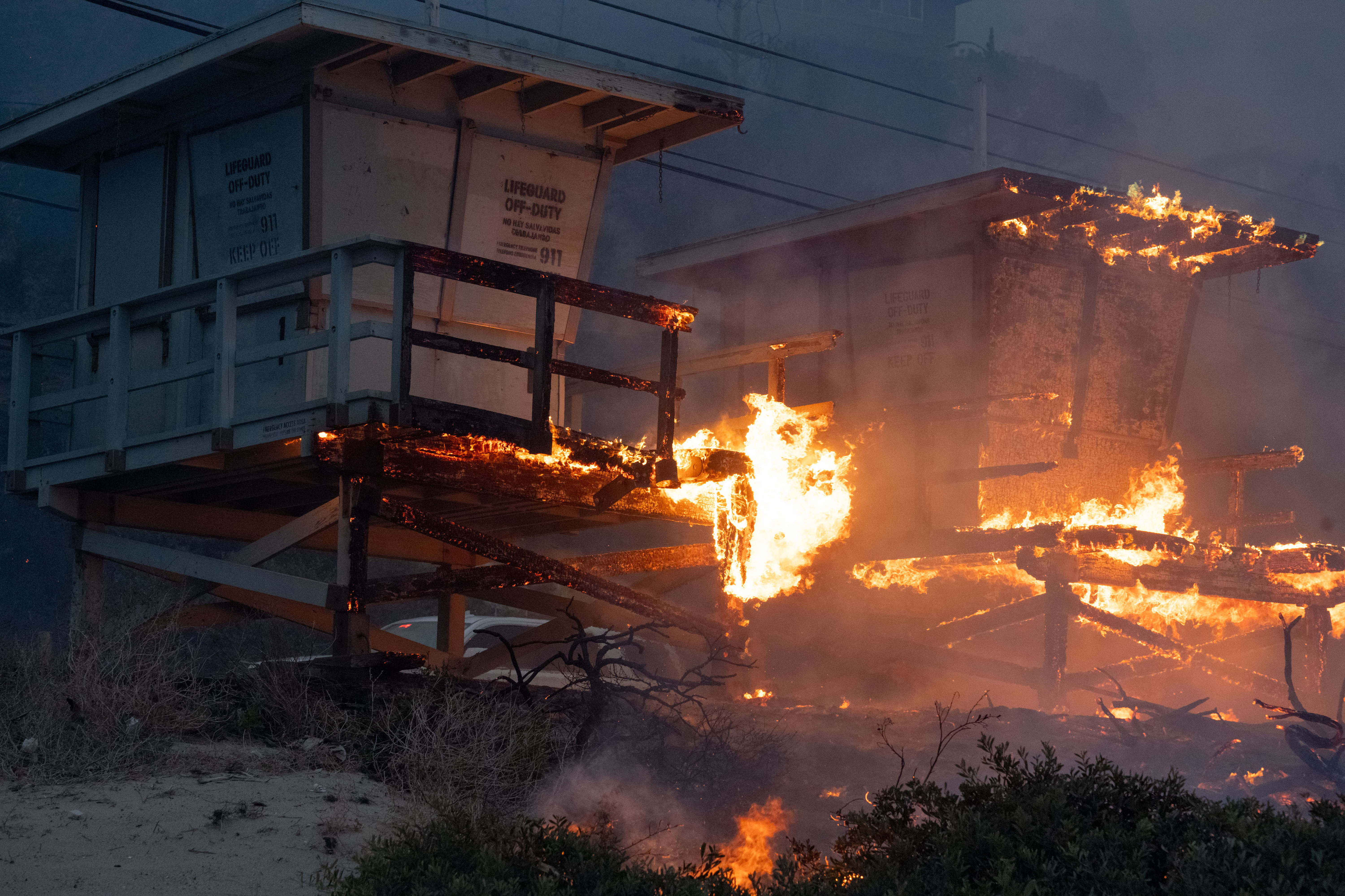 PACIFIC PALISADES, CA – JANUARY 07: Lifeguard towers go up in flames along Malibu beach in the Palisades Fire on Tuesday, January 7, 2025 (Photo by David Crane/MediaNews Group/Los Angeles Daily News via Getty Images)