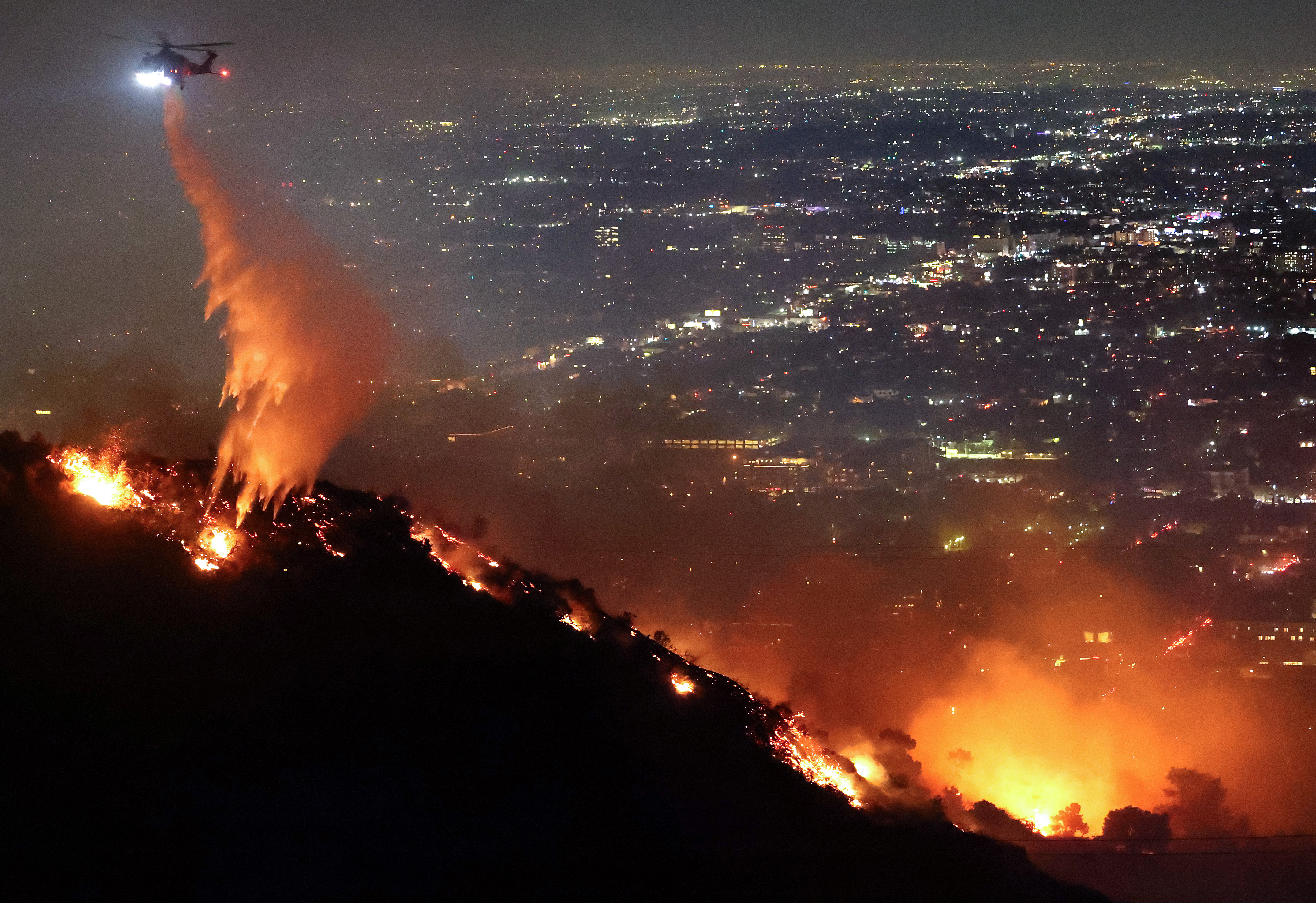 Images: Wildfires race across Southern California