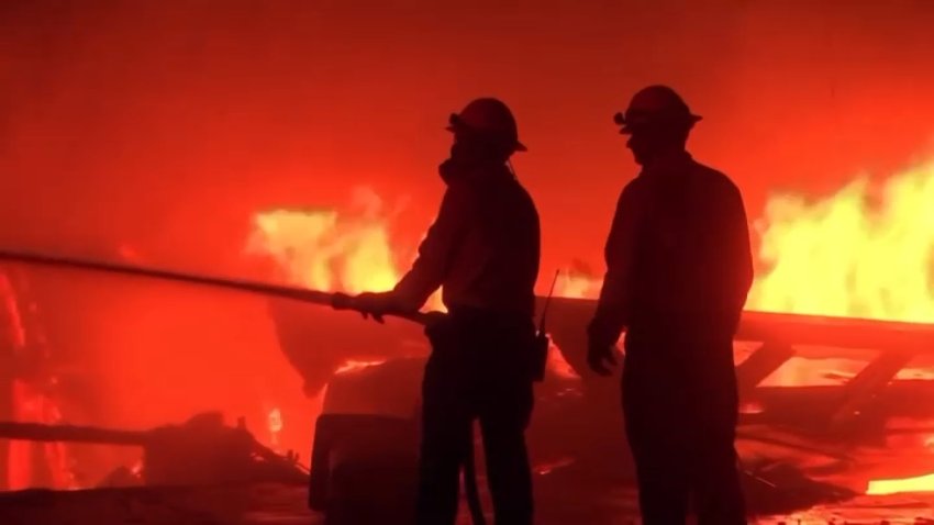 Firefighters respond to a brush fire in Los Angeles County.