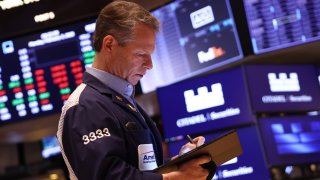 Dow rebounds from steep decline to finish with 100-point loss ...