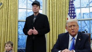 U.S. President Donald Trump speaks next to Elon Musk and X Æ A-12, Musk’s son, in the Oval Office of the White House in Washington, D.C., U.S., February 11, 2025. 