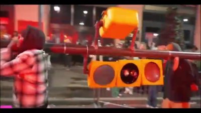 Videos: Eagles fans knock over, carry traffic light during Super Bowl celebrations