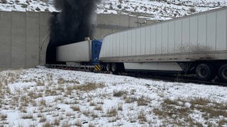 Smoke exits a tunnel