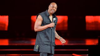 FILE – Comedian Dave Chappelle performs at Madison Square Garden during his 50th birthday celebration week, in New York, Aug. 22, 2023.