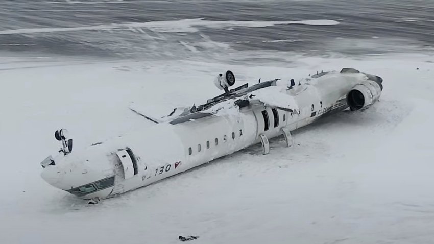 the crashed plane of Delta flight 4819 at Toronto Pearson International Airport