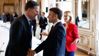 NATO Secretary General Mark Rutte (L) speaks with French President Emmanuel Macron (C) and Vice-President of the European Commission Kaja Kallas during an EU summit at the Egmont Palace in Brussels on February 3, 2025.