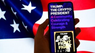 FRANCE – 2025/01/20: In this photo illustration, Trump Meme , Trump the Crypto president, is seen displayed on a smartphone screen. (Photo Illustration by Romain Doucelin/SOPA Images/LightRocket via Getty Images)