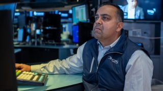 Traders work on the floor of the New York Stock Exchange on Feb. 13, 2025.  