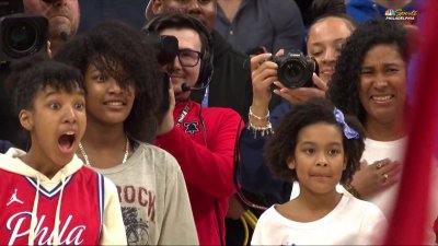 An incredible moment as Sixers help surprise US Navy Lieutenant's family