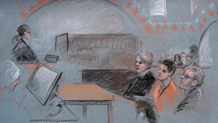 FILE - In this artist depiction, Massachusetts Air National Guardsman Jack Teixeira, seated second from right, appears in U.S. District Court, in Boston, April 19, 2023.