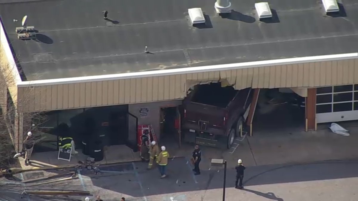Dump Truck Crashes into Tire Shop, Driver Hospitalized in Chester County