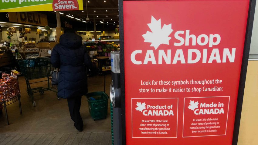 Close-up of ‘Shop Canadian’ poster displayed in a local storefront in Edmonton, Alberta, Canada, on April 4, 2025.