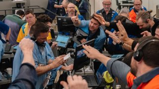Traders work in the S&P 500 Index (SPX) options pit at the Cboe Global Markets exchange in Chicago, Illinois, US, on Tuesday, April 8, 2025. 
