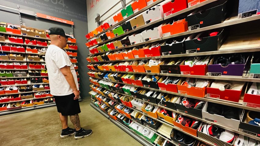 A man shops for shoes at a Nike outlet store in Los Angeles, California on April 10, 2025. 