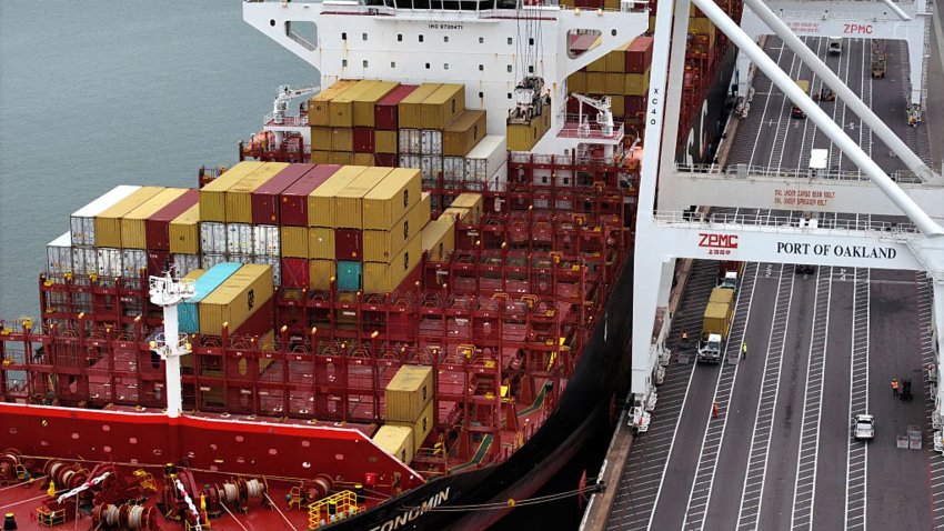 In an aerial view, a container ship is seen docked at the Port of Oakland in Oakland, California, on April 18, 2025.