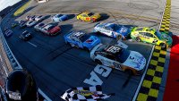 Austin Cindric, driver of the No. 2 Ford, takes the checkered flag to win