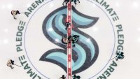 Marie-Philip Poulin takes a faceoff against Susanna Tapani in Seattle