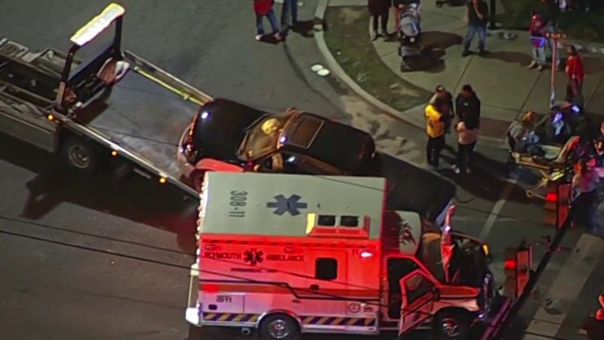 Crash involving ambulance and pickup truck closes intersection in ...