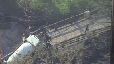 Crews remove propane truck from collapsed bridge