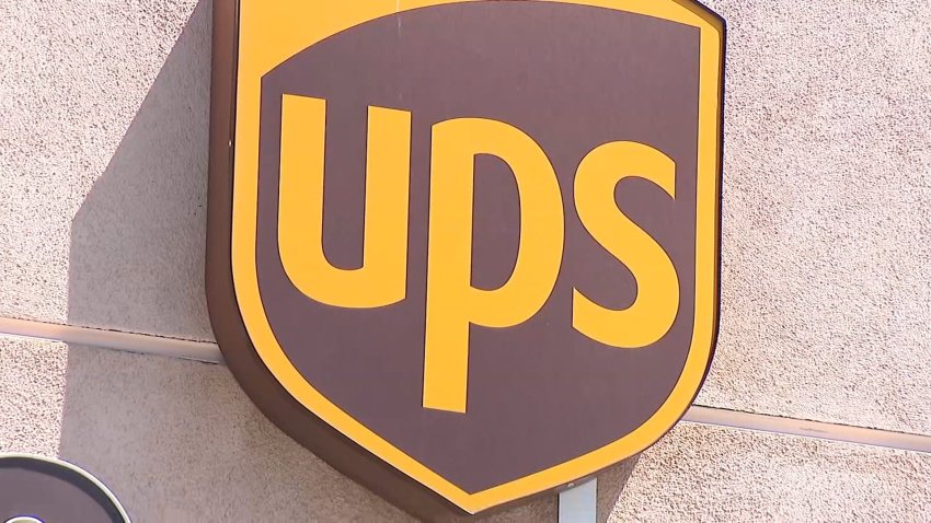 The UPS logo on a storefront.