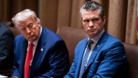 President Donald Trump and Defense Secretary Pete Hegseth listen during a cabinet meeting at the White House on Thursday, April 10, 2025.